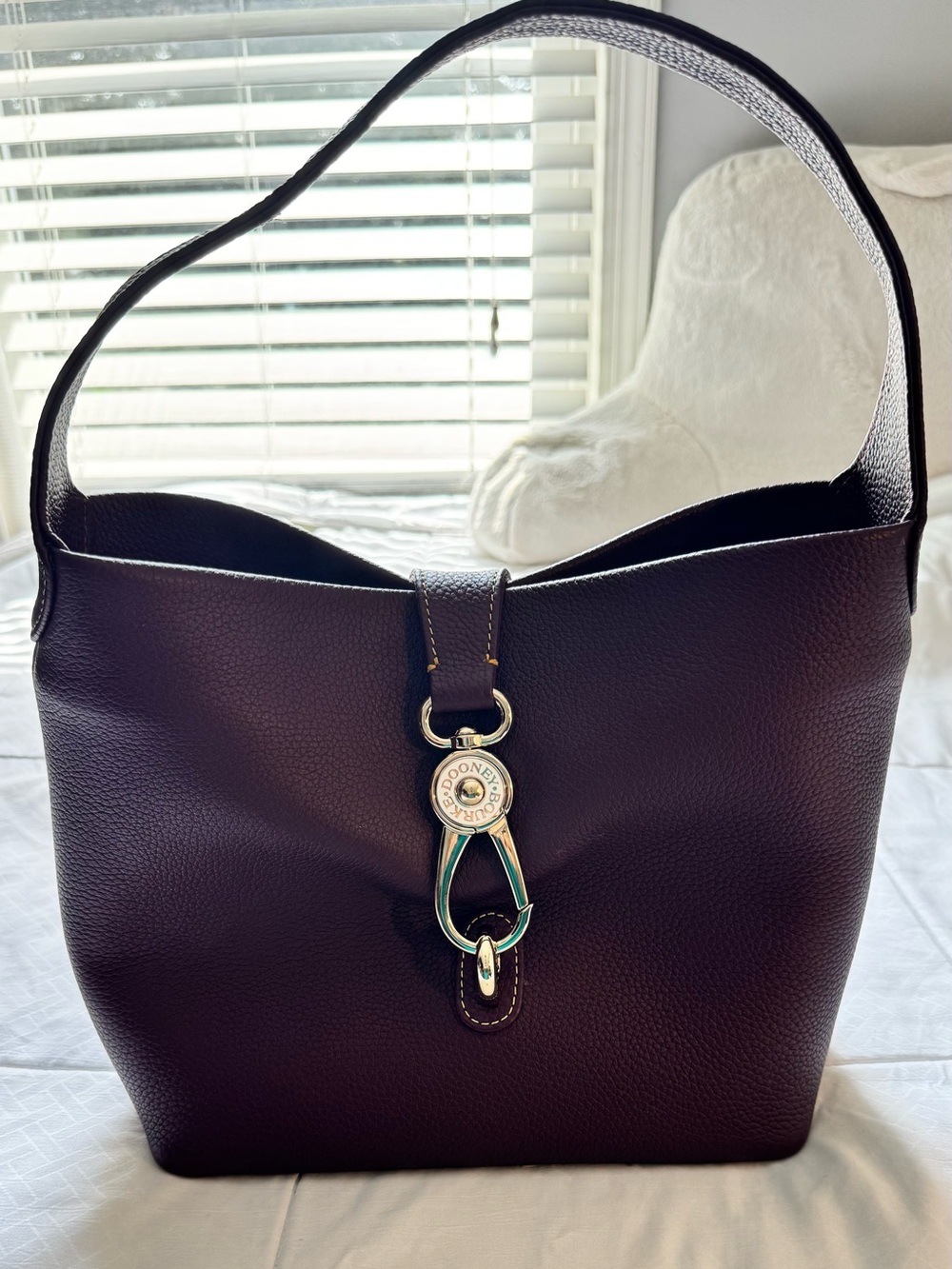 Dooney & Bourke Pebbled Leather Shoulder Bag in the color wine